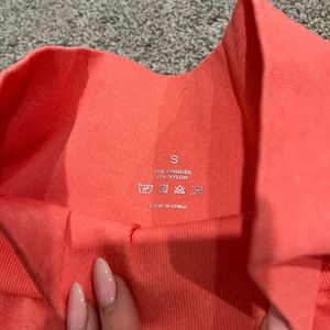 NVGTN. Salmon/ melon colored